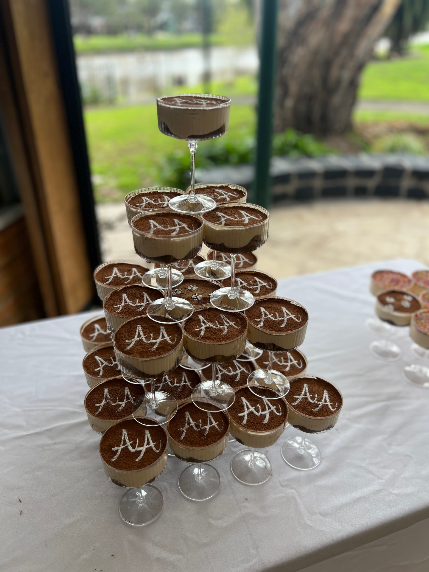 Personalised tiramisu coupe tower at a wedding