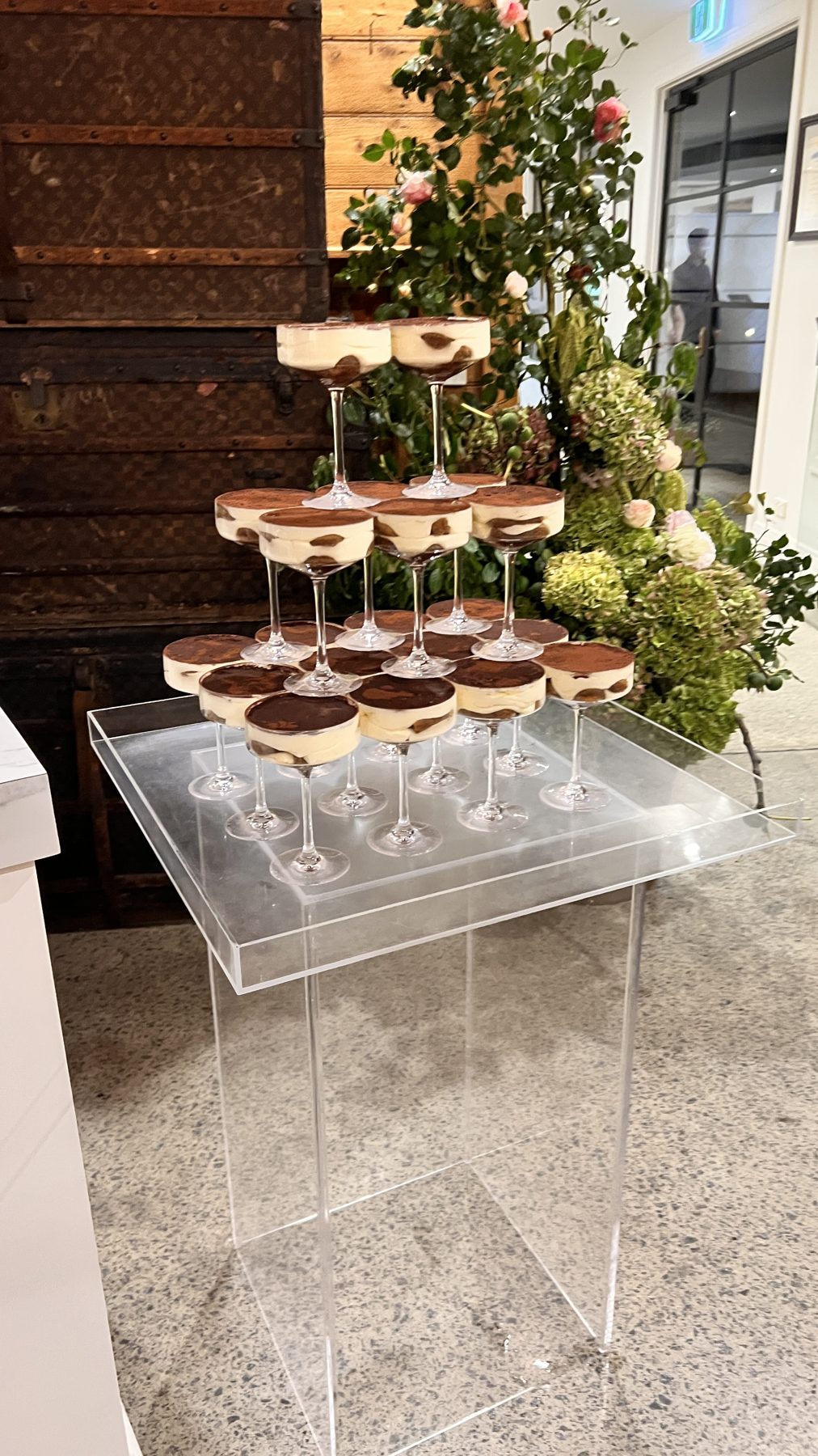 Tiramisu cups arranged in a coupe tower for a wedding reception